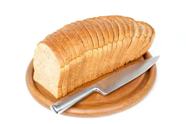 cutting large pieces of bread
