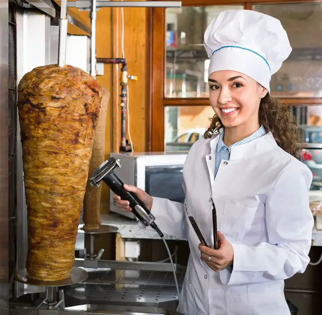 Beautiful woman with electric knife